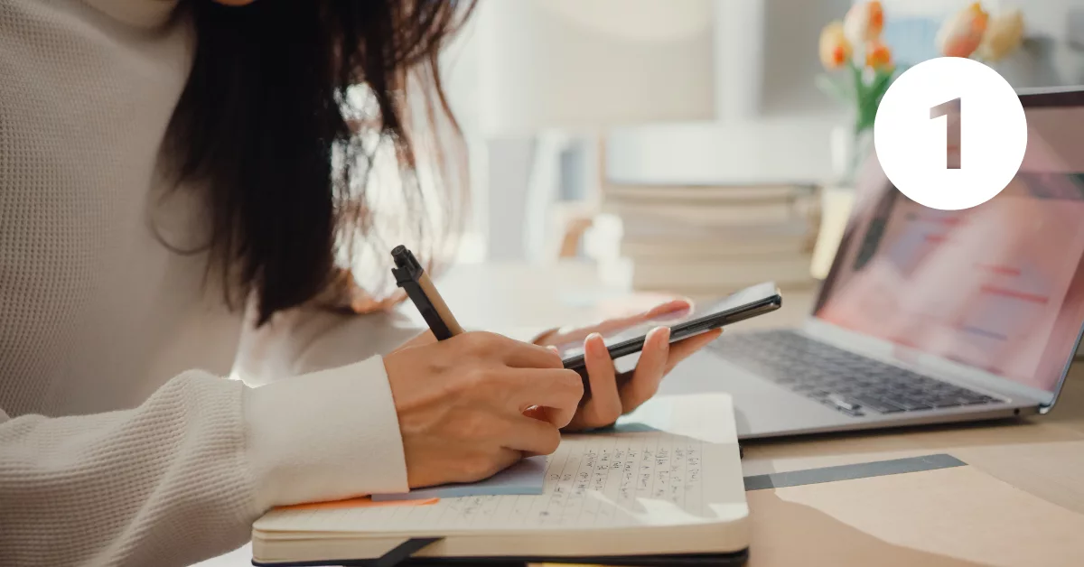 1 Image of a woman writing down her appointment.
